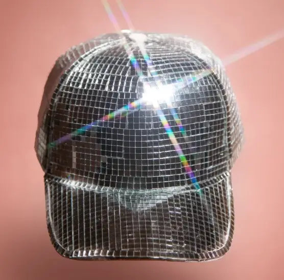 A shimmering silver disco party cap featuring a reflective grid-like surface designed as a mirrored peaked hat.