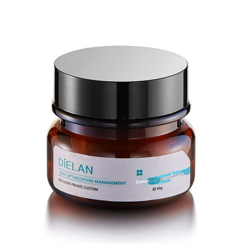 Ein elegantes Bernstein-Glasbehältnis mit einem glänzenden schwarzen Deckel, beschriftet mit „dielan retinol serum cream“ in türkisfarbenem und weißem Text für Retinol-Gesichtspflegecreme gegen vorzeitige Hautalterung und zur Straffung, 30 ml.