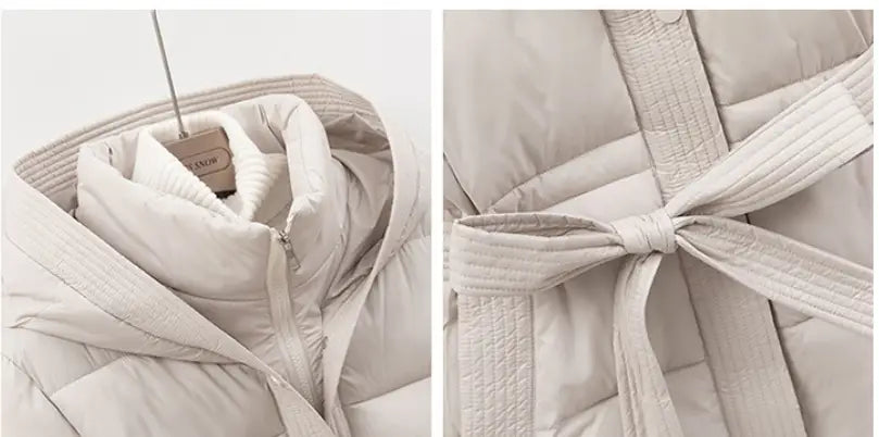 Beige quilted hooded winter puffer coat made of padded material with a matching belt tied in a bow.