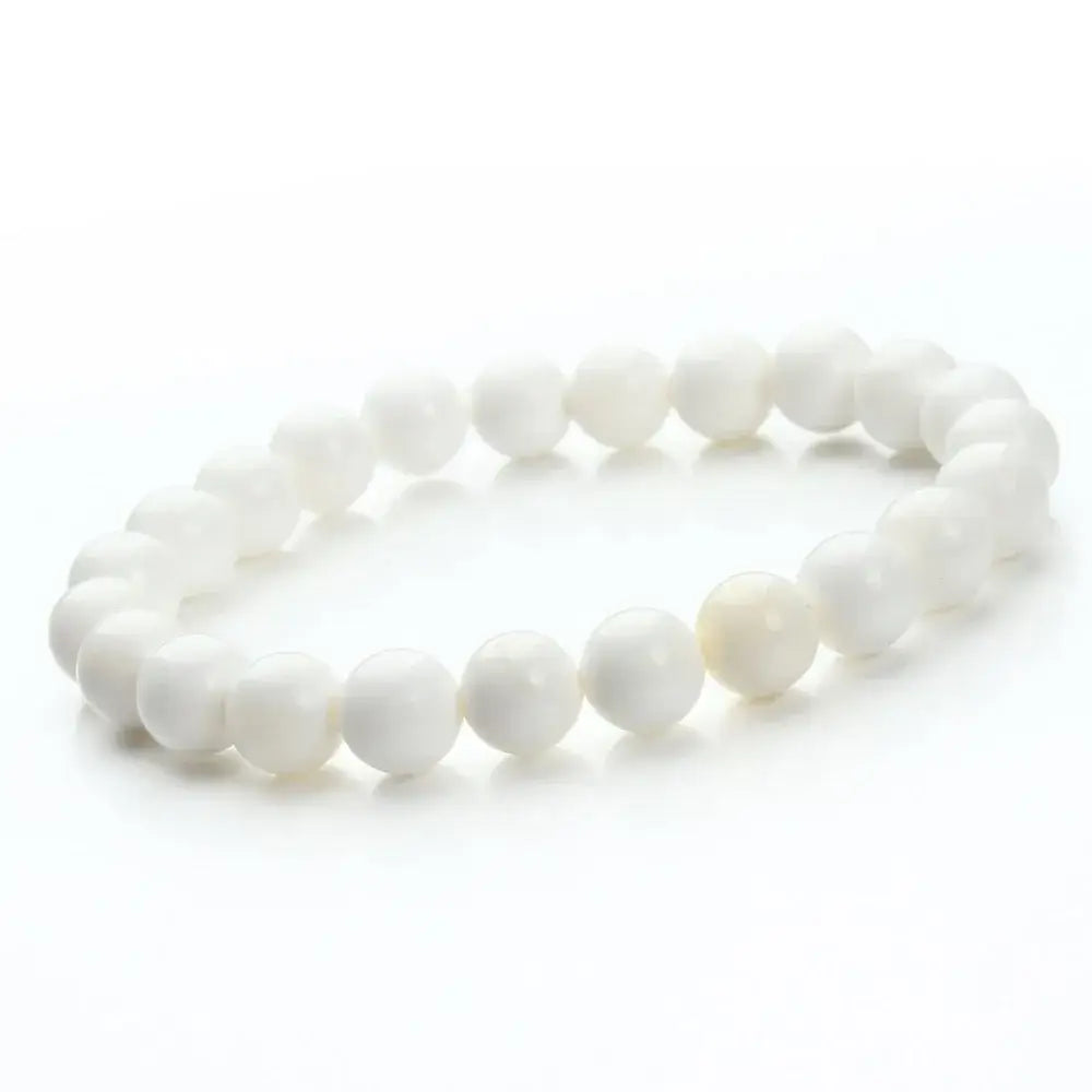 a natural polished gemstone and agate white beaded bracelet featuring smooth, round stones arranged in a continuous loop