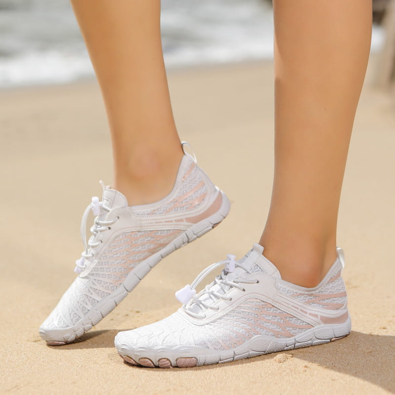 Breathable non slip quick dry water sports shoes in white and blush pink with a mesh upper and segmented rubber sole