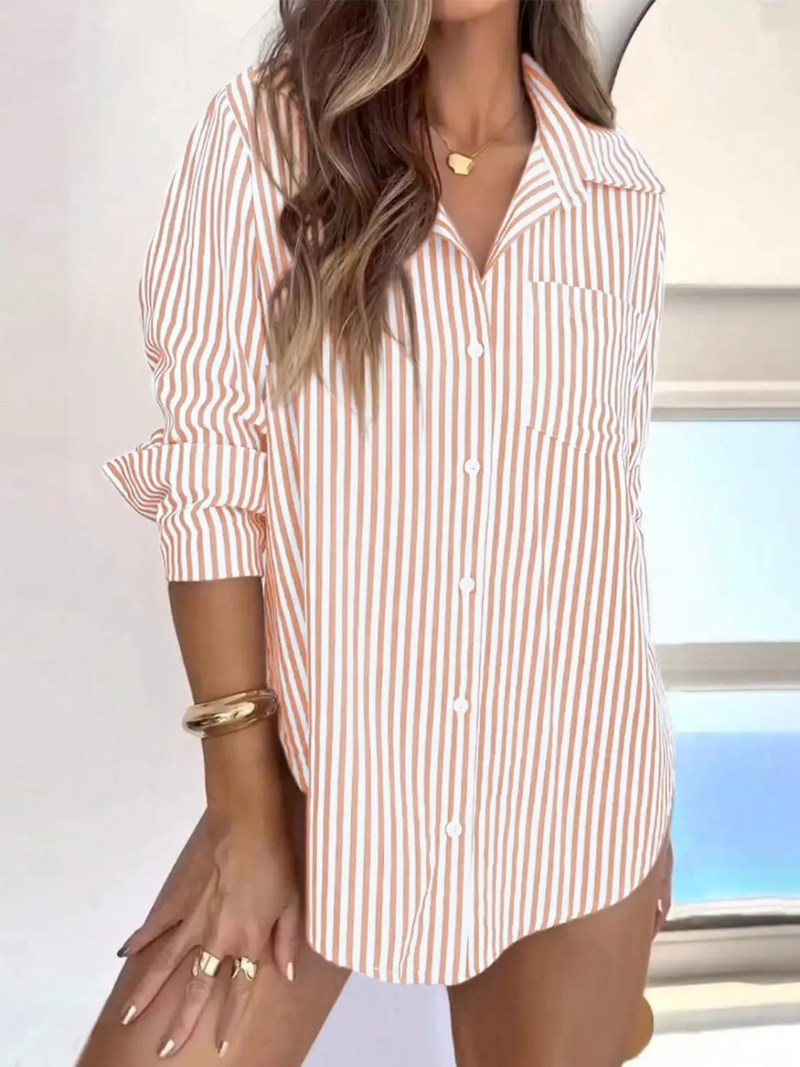 Women striped long sleeve button up shirt dress with loose fit and vertical soft peach and white stripes.
