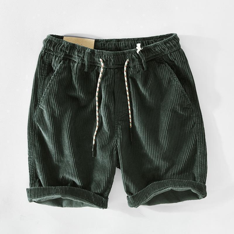 Men’s premium ribbed dark green corduroy shorts with a drawstring waistband and rolled cuffs.