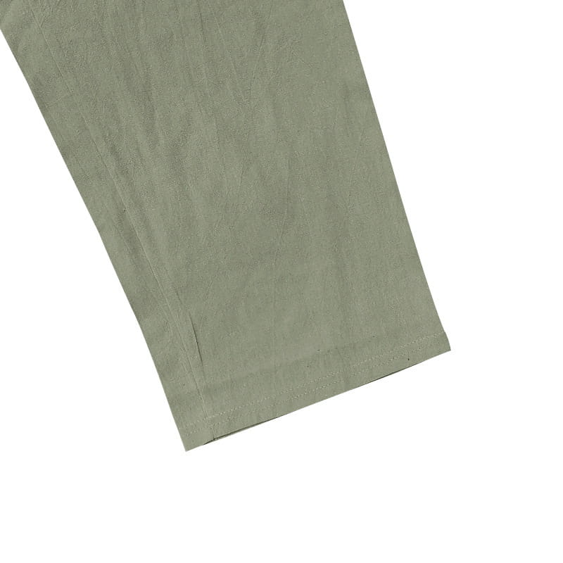 Men’s linen joggers casual drawstring pants feature an olive green cotton pant leg with a subtle textured weave and neatly stitched hem.