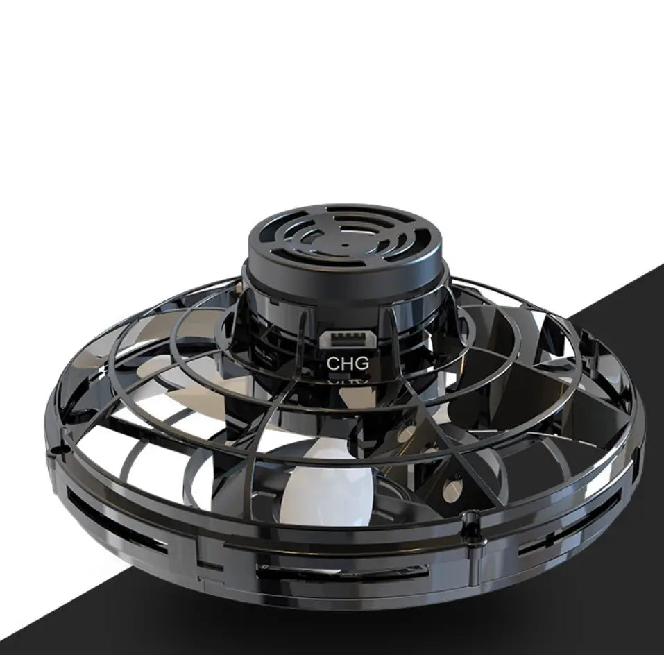 Black flying ufo spinner led mini drone with a circular design and visible propellers hovering as a fingertip gyro toy.