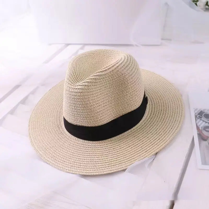 Beige straw fedora hat with a black ribbon band designed for men featuring UV proof material.