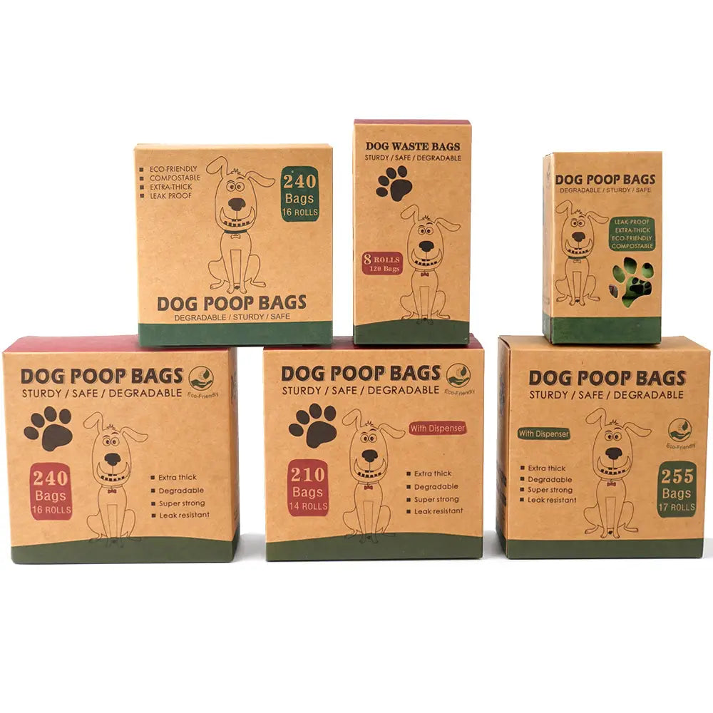 brown cardboard boxes of biodegradable thickened dog waste bags featuring cartoon dogs and paw prints labeled with quantities of 240 and 255 bags per roll for pet poop disposal.
