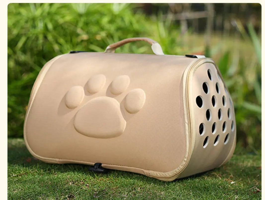 Beige eva folding pet carrier bag featuring a raised paw print design and circular ventilation holes.
