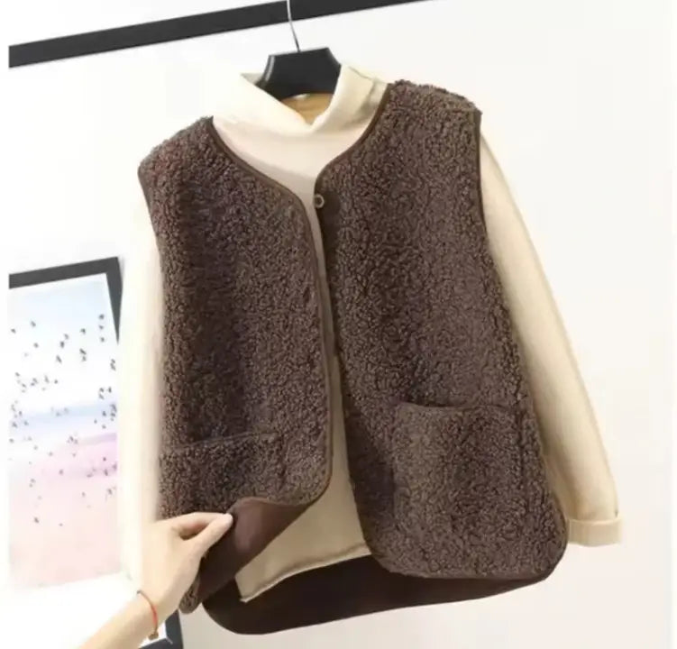 Brown faux fur vest with a cozy textured surface and simple front closure for plush fleece vest women cozy winter outerwear.