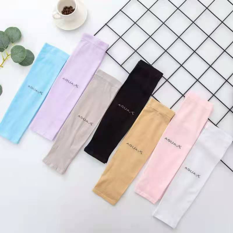 Aquax uv protection cooling arm sleeves in soft pastel and solid colors made of smooth fabric with subtle branding designed for driving.