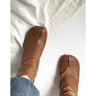 brown leather ankle boots with a split-toe design and high heels showcasing tabi style craftsmanship