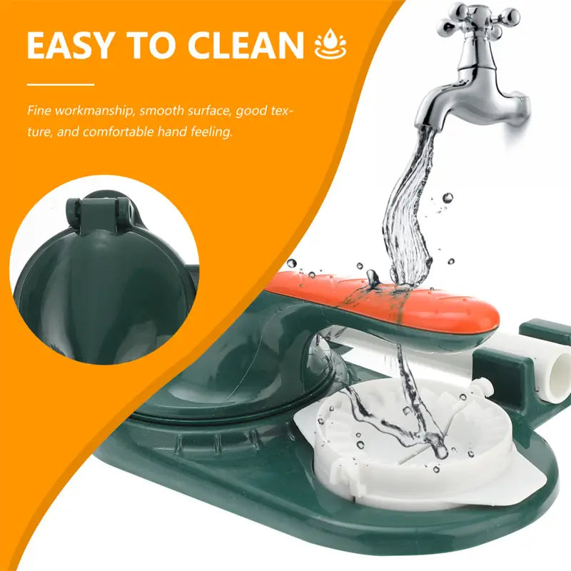Green and orange plastic Dumpling Maker 3 in 1 manual dough pressing tool with a white sponge holder for dishwashing station use.