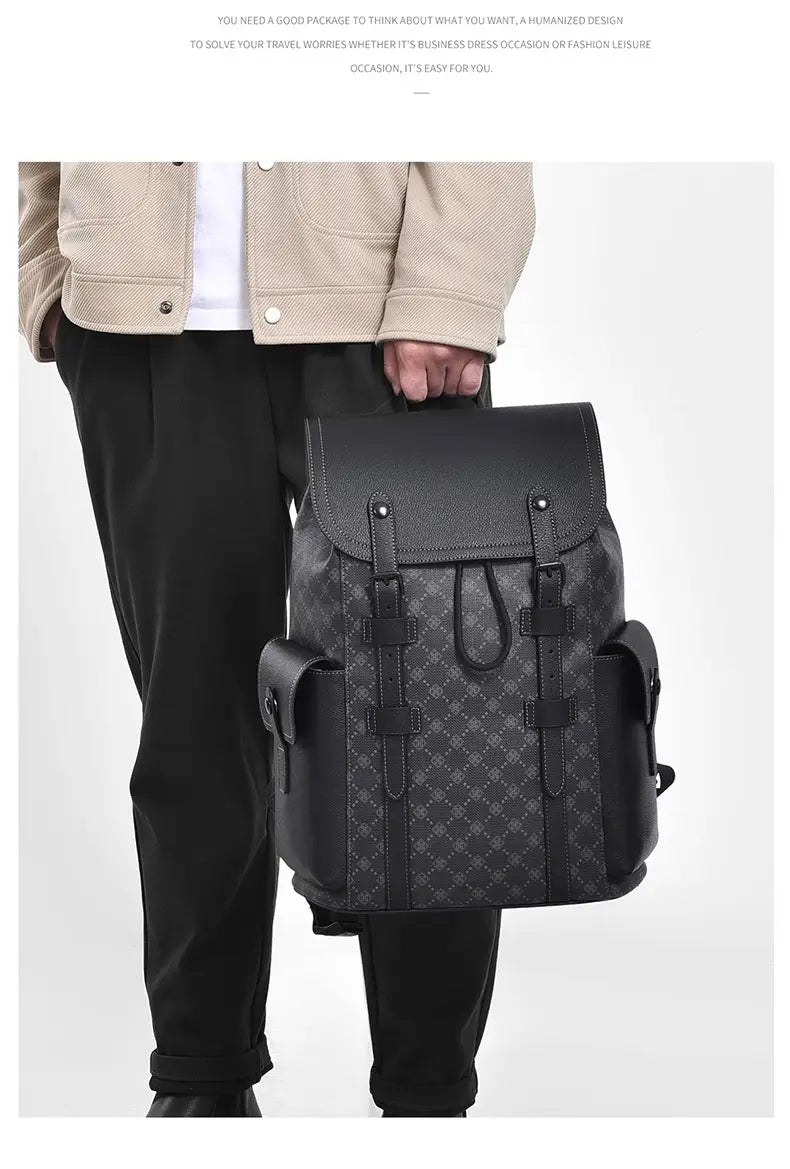 Black leather men’s business travel backpack with laptop sleeve featuring a subtle patterned design and multiple front pockets.