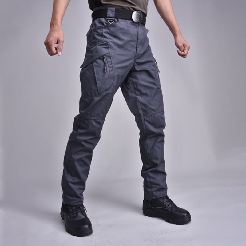 Dark gray tactical military combat pants for men with multiple cargo pockets and a sturdy belt designed for durability and functionality.