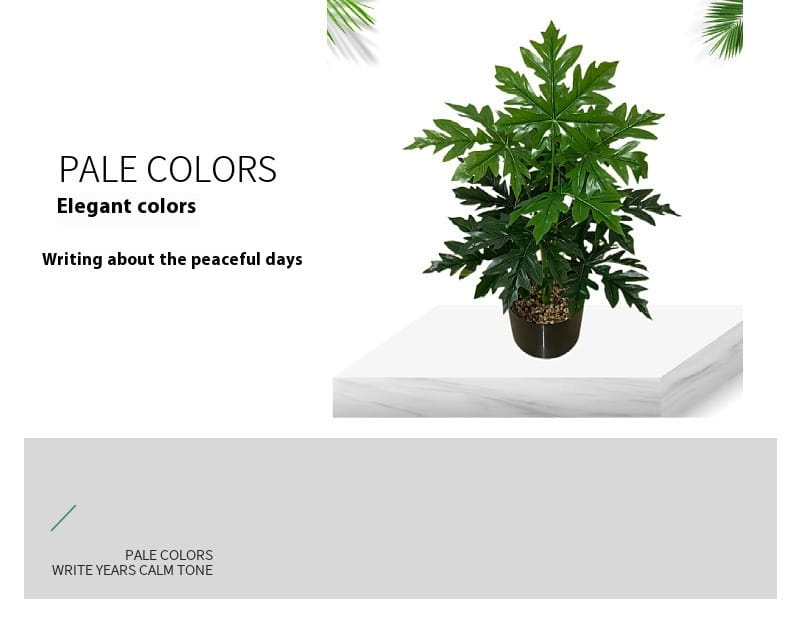 Artificial monstera turtle leaf potted plant featuring a lush dark green artificial papaya plant with broad glossy leaves in a sleek black pot for garden decor.