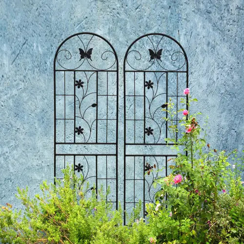 Black wrought iron garden trellis with an arched top featuring rustproof butterfly and floral designs, included in a 2 pack measuring 71 inches.