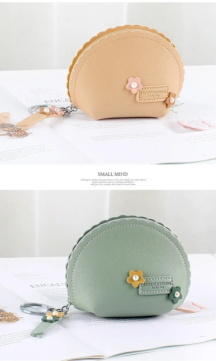 Beige and sage green floral scalloped pu leather coin purses with keychain attachments.