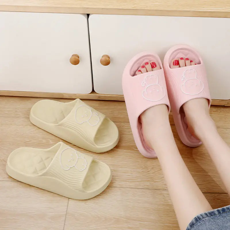 Pink and cream-colored dog cartoon slide sandals made of non slip EVA material for house use.