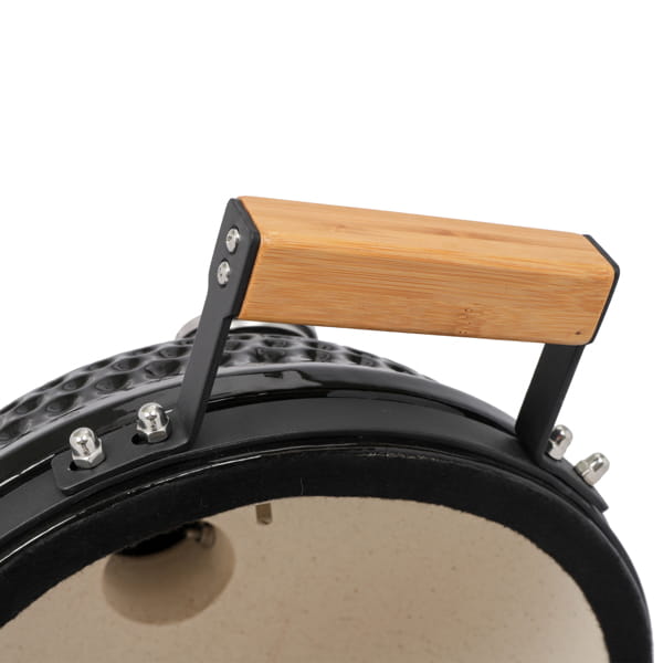 Black ceramic 13 inch kamado charcoal grill with a light wood handle.