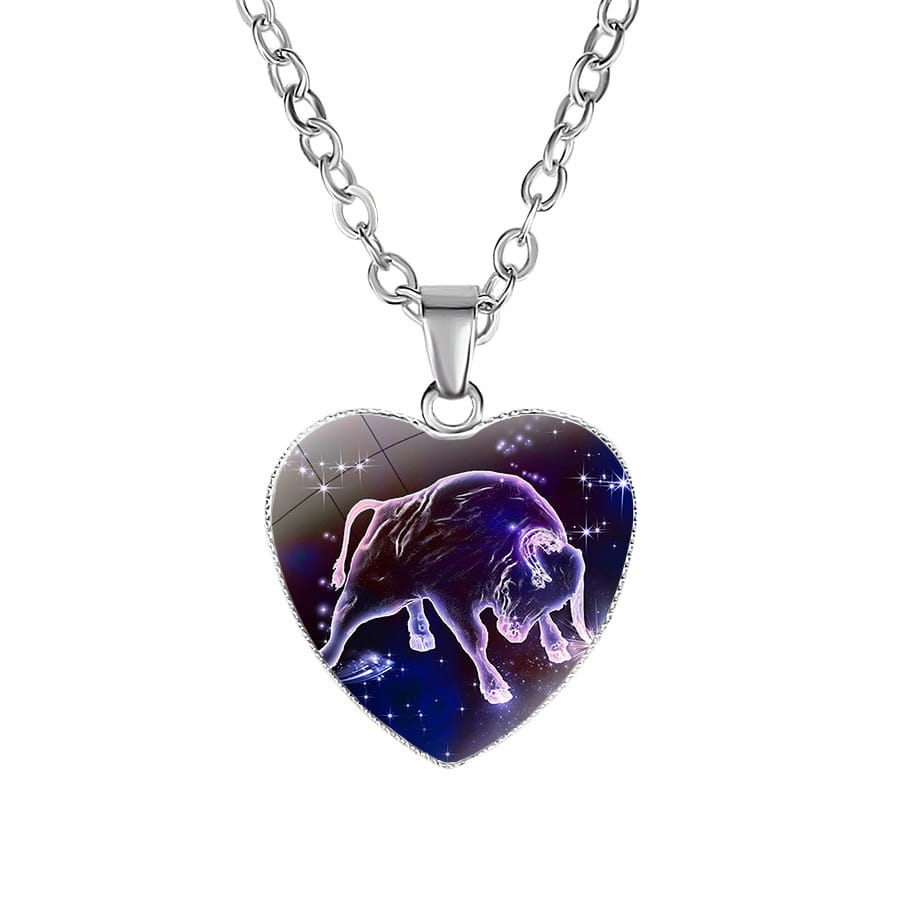 Silver heart-shaped pendant necklace featuring a vibrant purple and blue cosmic design with an illustrated Taurus bull from the Zodiac Celestial Heart Pendant Galaxy Constellation Necklace collection.