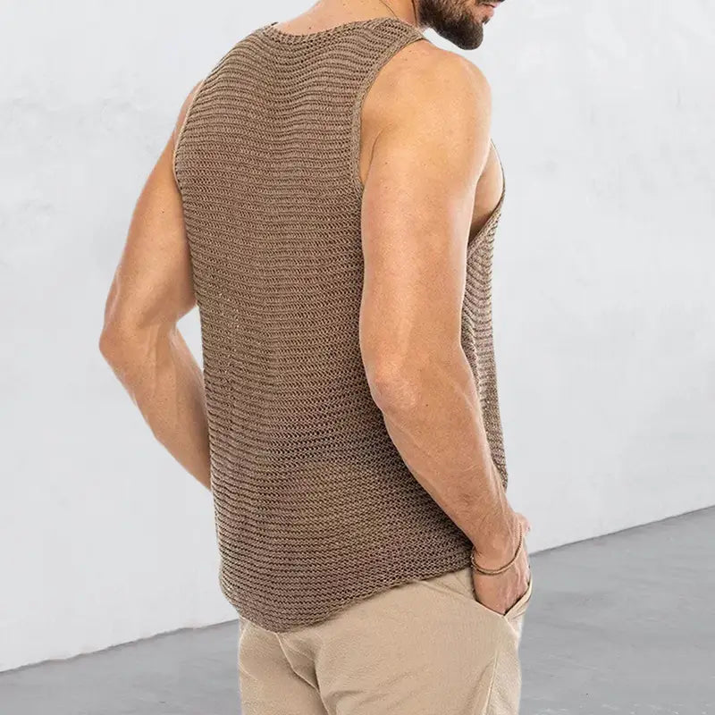 A textured brown knitted sleeveless tank top with a ribbed pattern designed as a men’s ribbed knit scoop neck sleeveless vest.