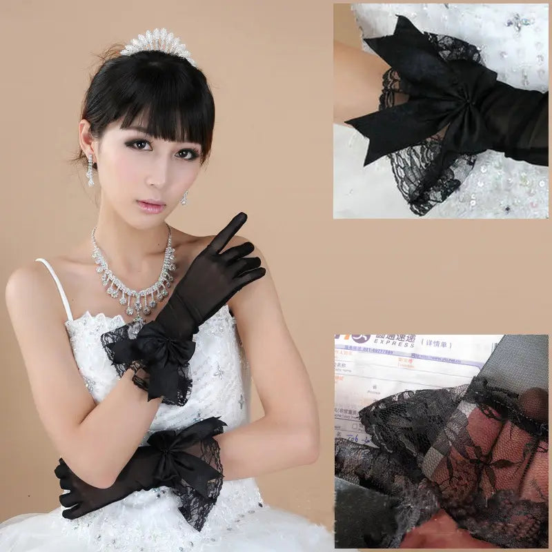 Elegant black lace evening gloves featuring satin bows and sheer mesh detailing.
