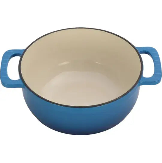 Blue enameled cast iron 6qt Dutch oven with cream-colored interior and black rim accompanied by silicone gloves.