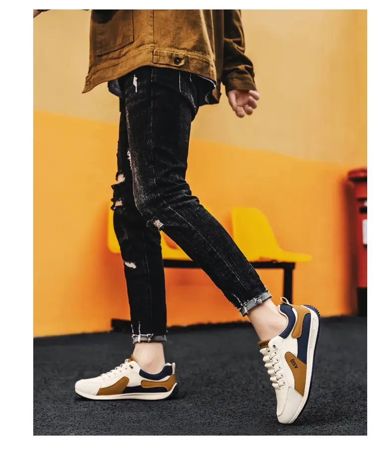 Men’s casual sports sneakers non slippery microfiber shoes in white and tan with navy blue accents featuring a classic low top lace up design.