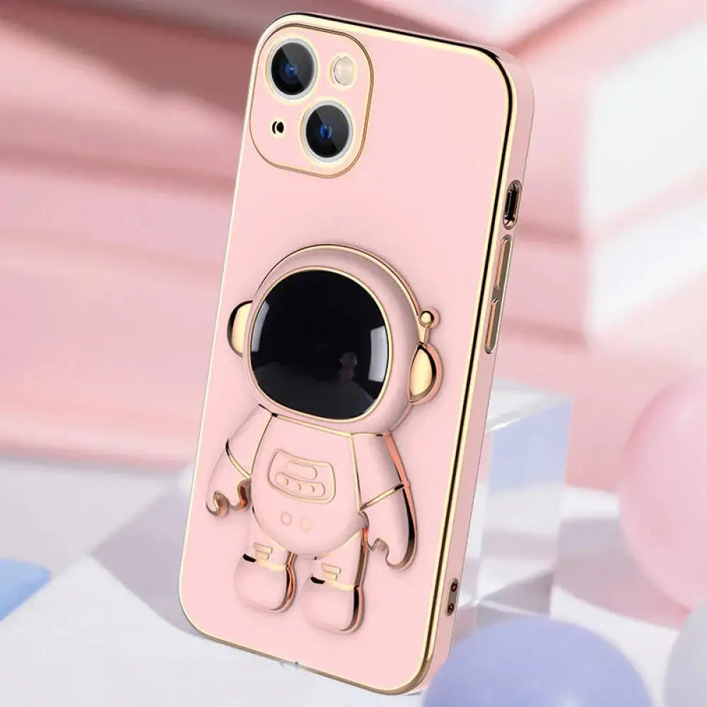 Pink 3d astronaut electroplated anti-drop phone case with gold trim and standing figure shown from the back side