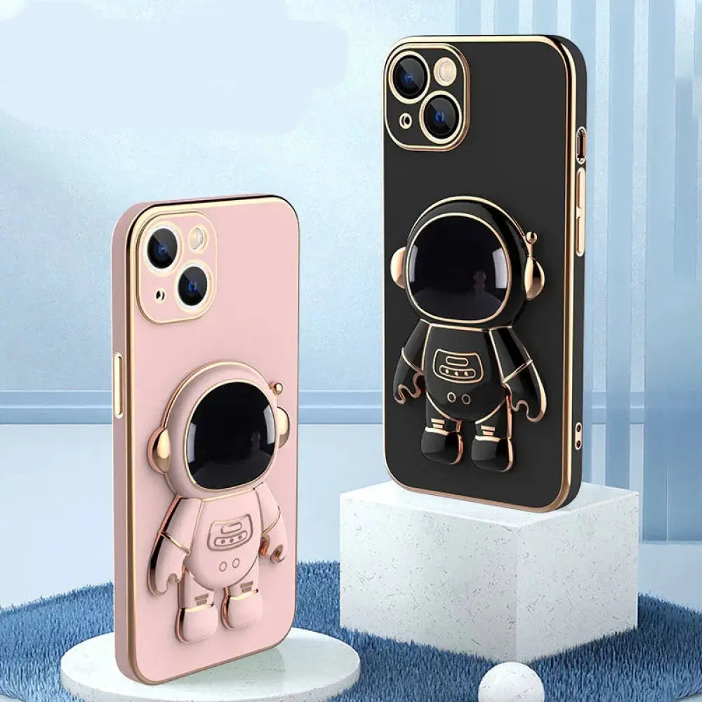 Back side of pink and black 3d astronaut electroplated anti-drop phone cases with gold trim and stand