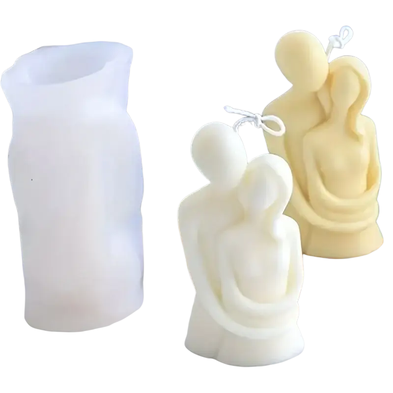 White silicone 3d couple hug candle mold beside two cream-colored abstract couple candles with tied strings