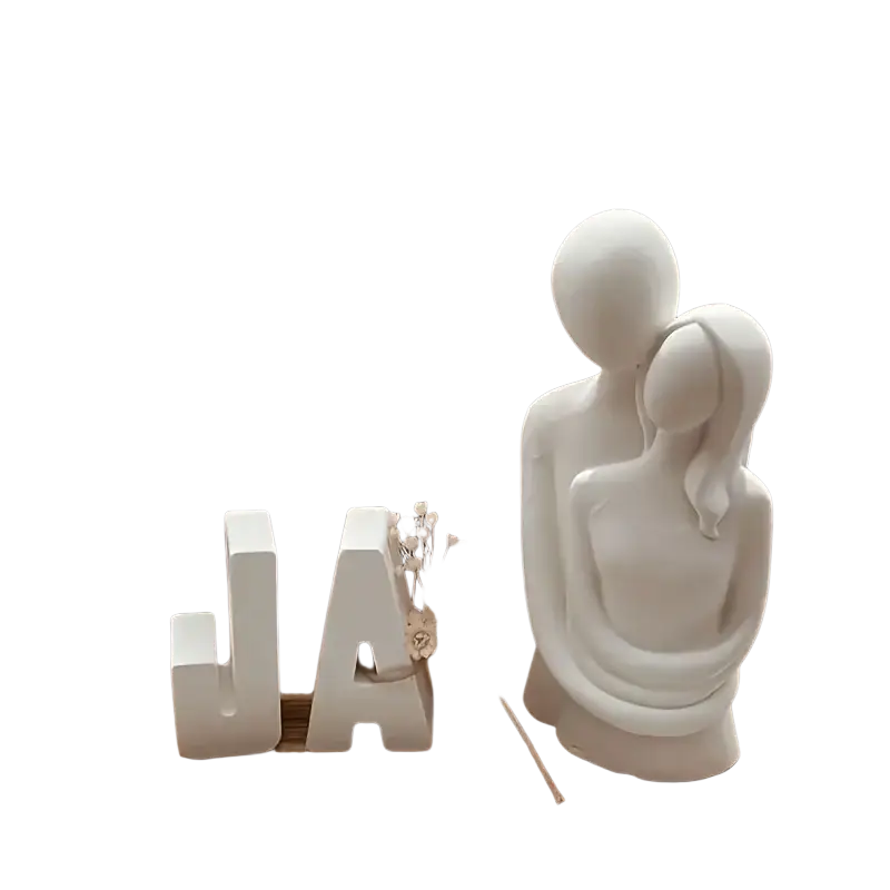 White ceramic couple sculpture with smooth minimalist design in a 3d couple hug silicone candle mold