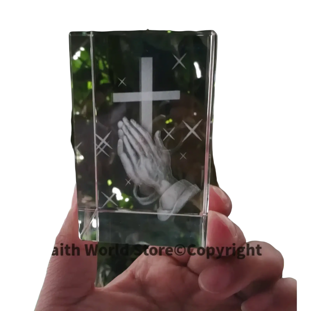 Clear crystal block 3d statue featuring an engraved cross and praying hands design in transparent crystal material
