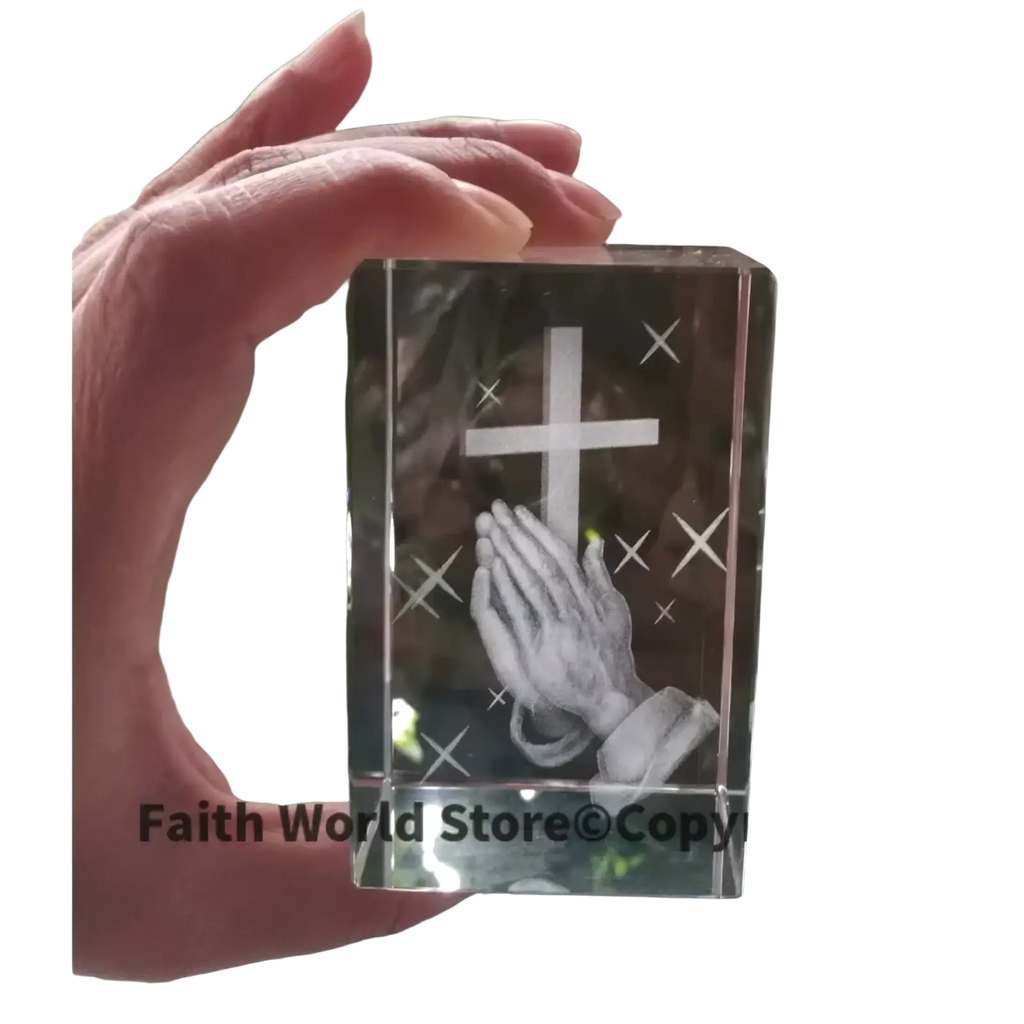 Clear crystal cross praying hands statue featuring engraved cross and praying hands with starburst details