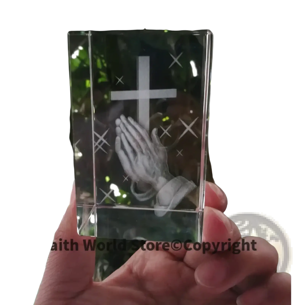 Clear crystal block 3d statue featuring an engraved cross and praying hands design in transparent crystal material