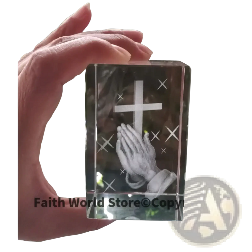 Clear crystal cross praying hands statue featuring engraved cross and praying hands with starburst details
