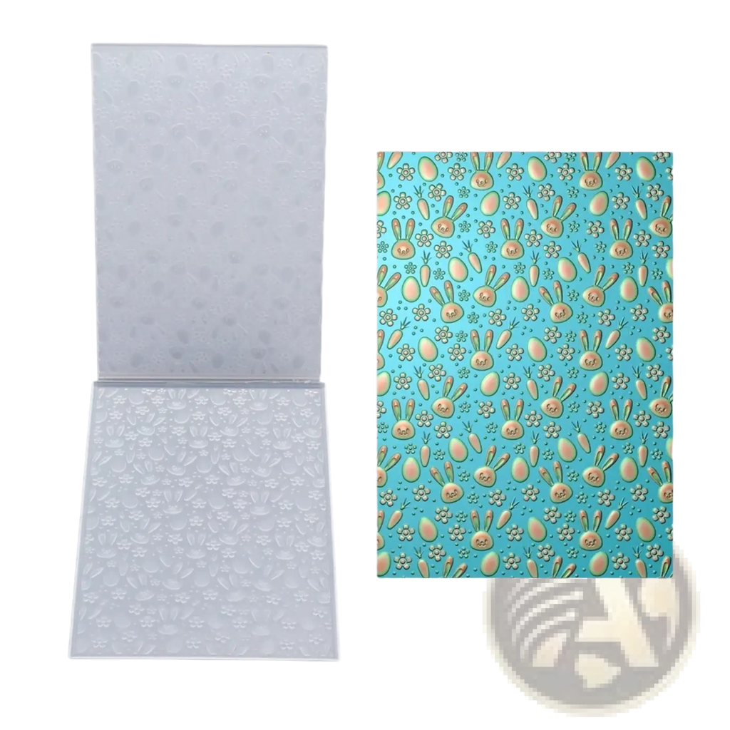 Clear plastic 3d floral embossing folder with easter bunny and egg designs for card making on light blue background