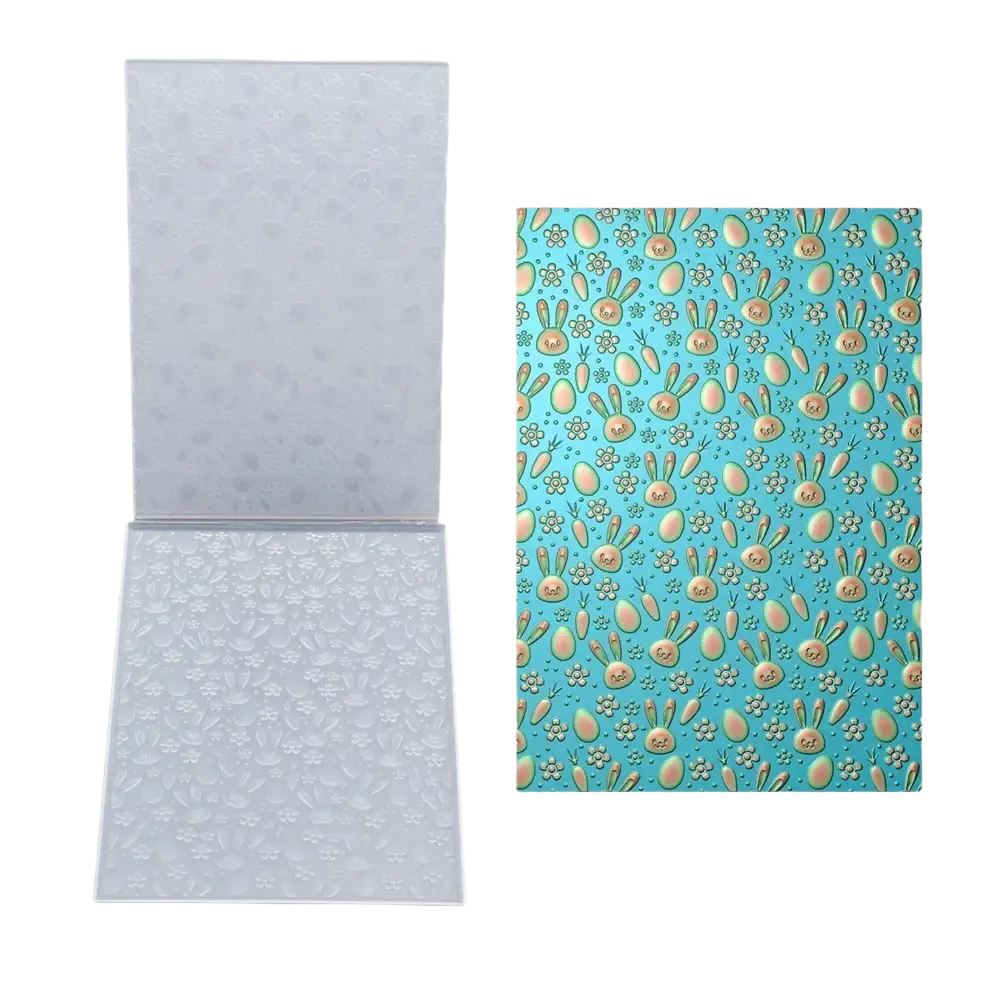 Clear plastic 3d floral embossing folder with easter bunny and egg designs for card making on light blue background