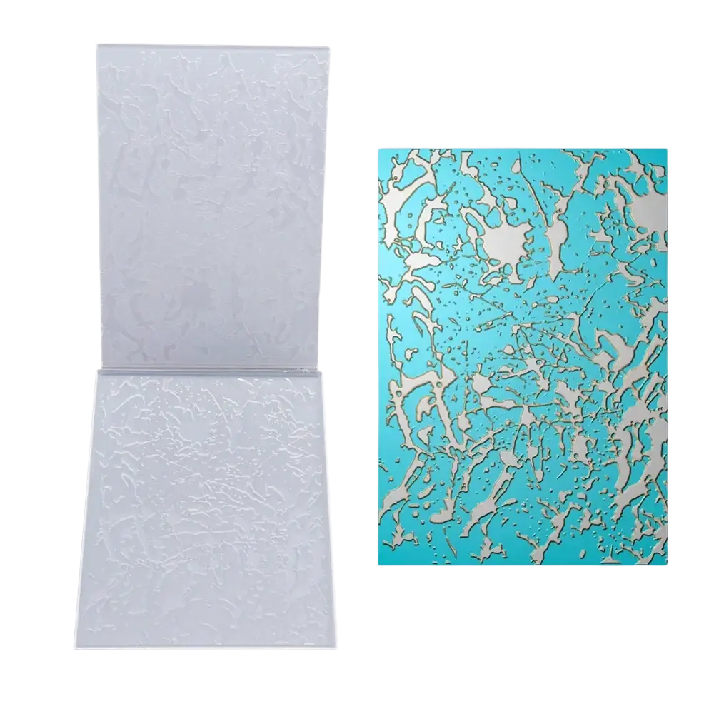 A translucent white acrylic 3d floral embossing folder with embossed texture and turquoise stencil for card making