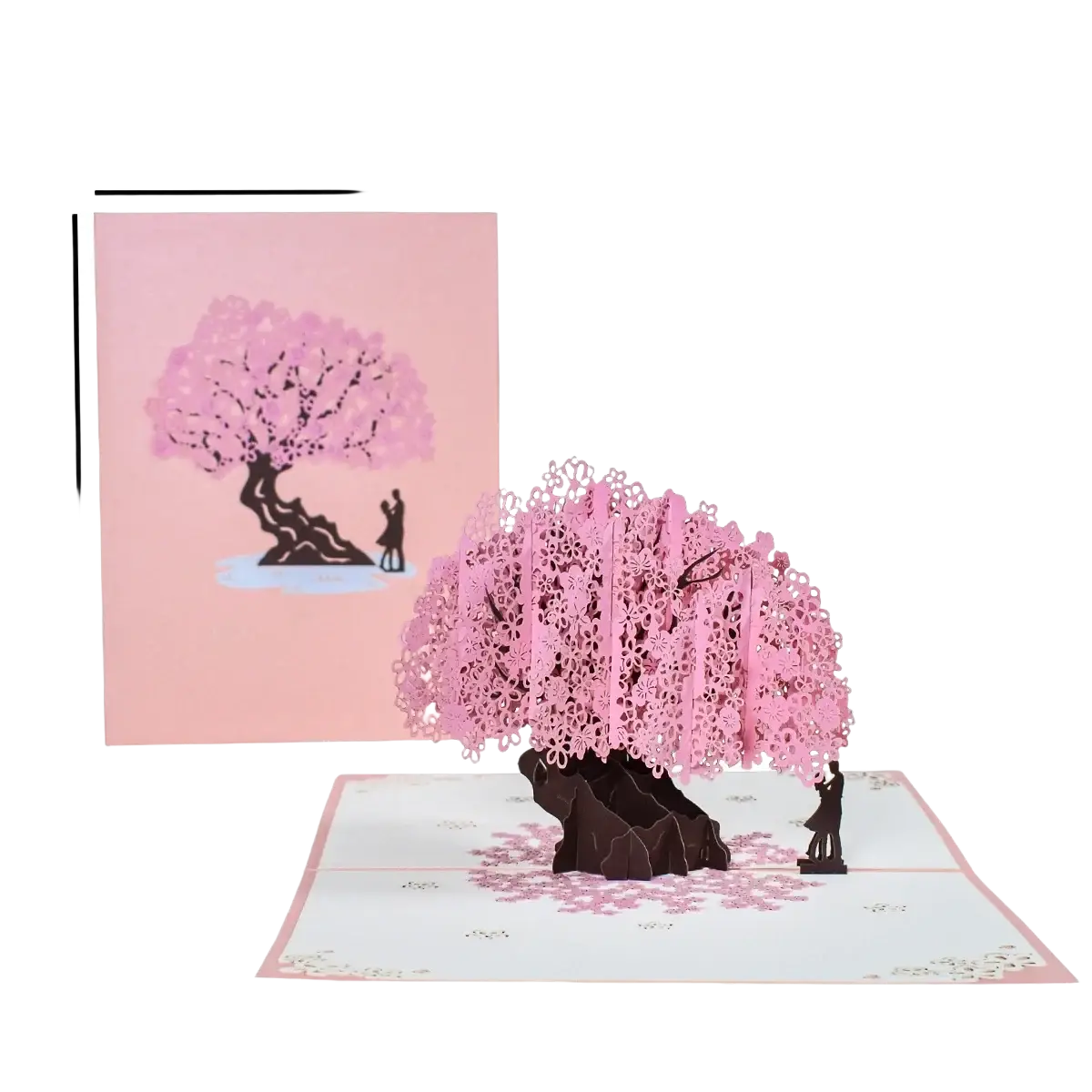 A delicate pink and dark brown 3d pop up valentine card featuring an intricately cut cherry blossom tree with a couple silhouette