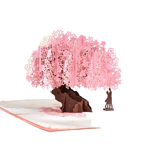 3d pop up valentine card featuring a delicate pink cherry blossom tree with lace-like petals and a couple figure beneath