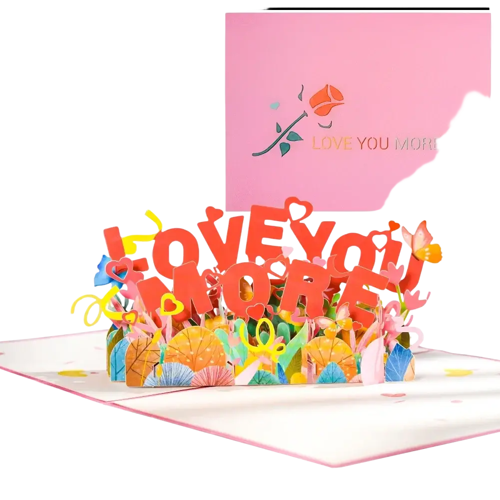 A vibrant 3d pop up valentine card with bold red love you more text and colorful paper flowers and hearts