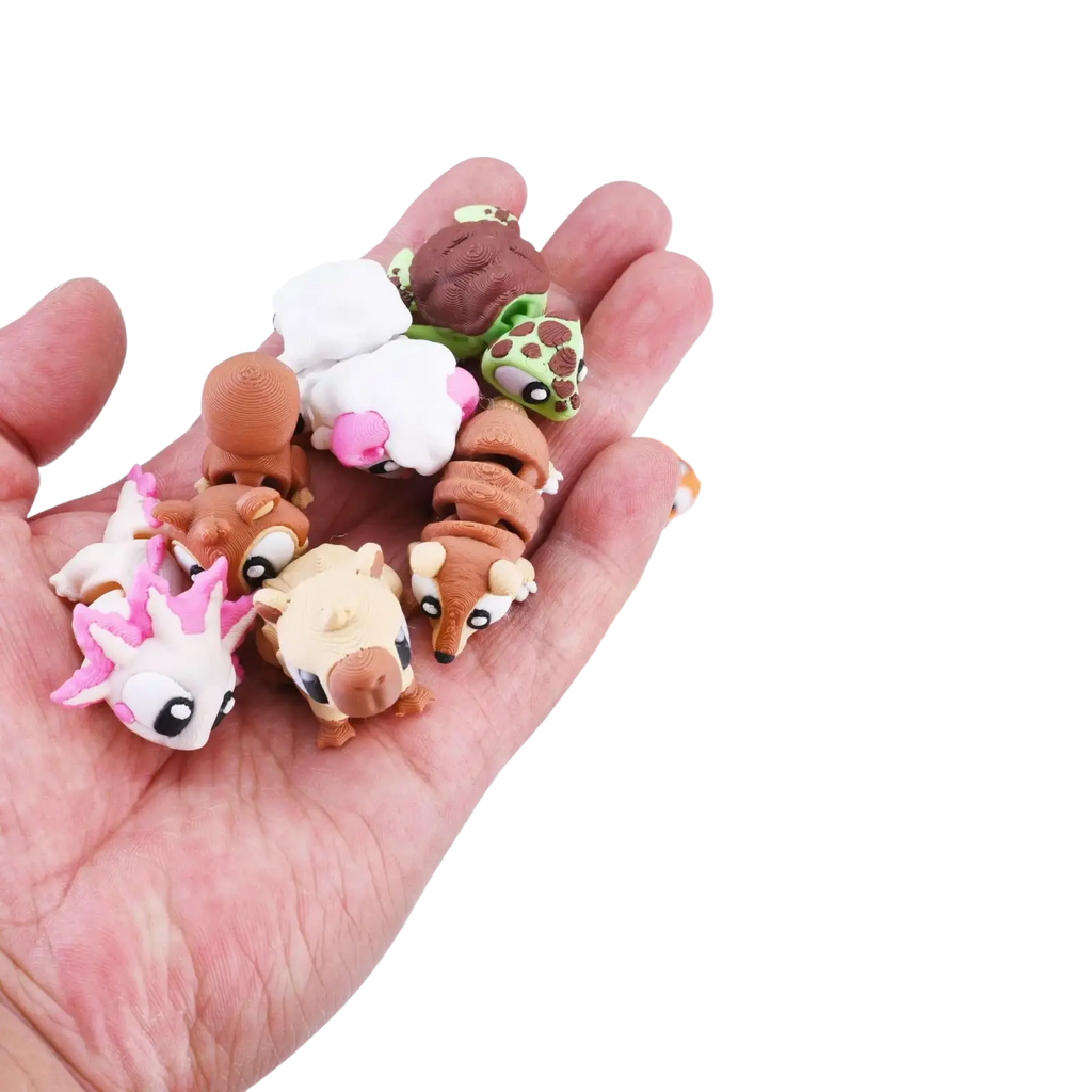 A collection of colorful 3d printed animal figurine toys with cute cartoon faces as finished goods
