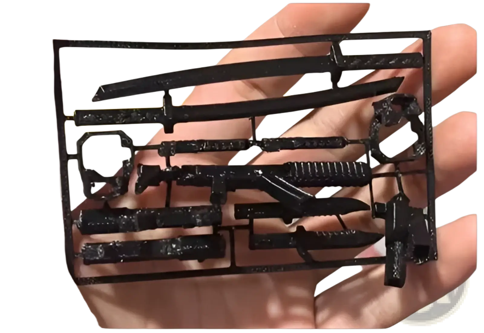 Black 3d-printed plastic articulated robot action figure dummy 2.0 model kit with miniature swords guns and knives on frame