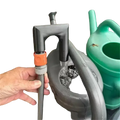 Black plastic 3d printed pla garden pump with orange connector and gray hose attachment for polylactic acid water flow