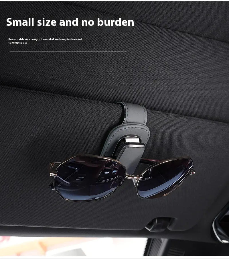Gray leather car glasses clip holder with a sleek minimalist design for sun visor use in a pu leather case.