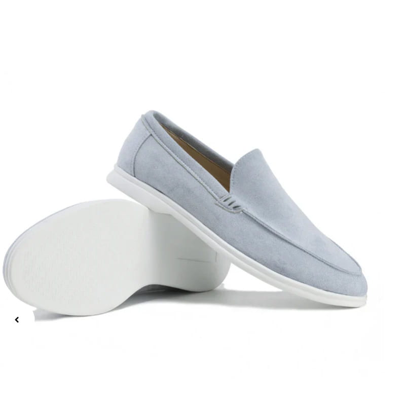 Men’s suede summer loafers featuring light blue suede material with a white rubber sole for casual slip on wear.