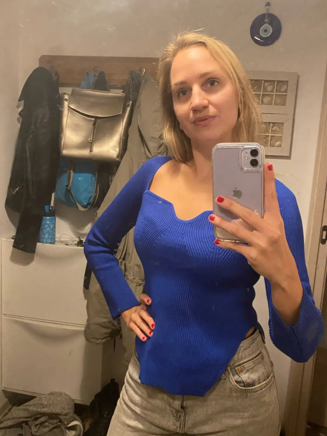 Vibrant blue ribbed sweet heart neck long sleeve knit pullover with a square neckline and asymmetrical hemline.