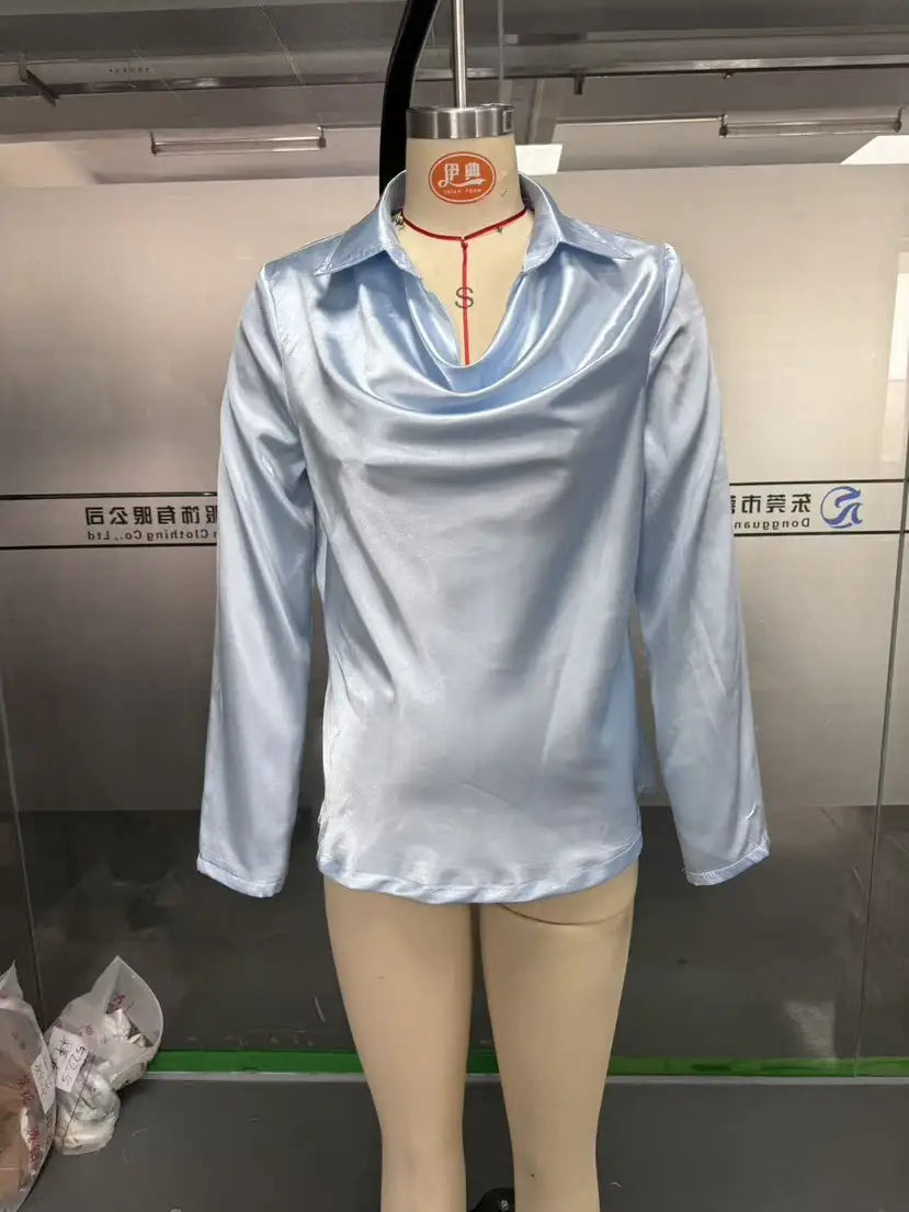 Light blue satin long-sleeved blouse with elegant cowl neck and subtle sheen for women.
