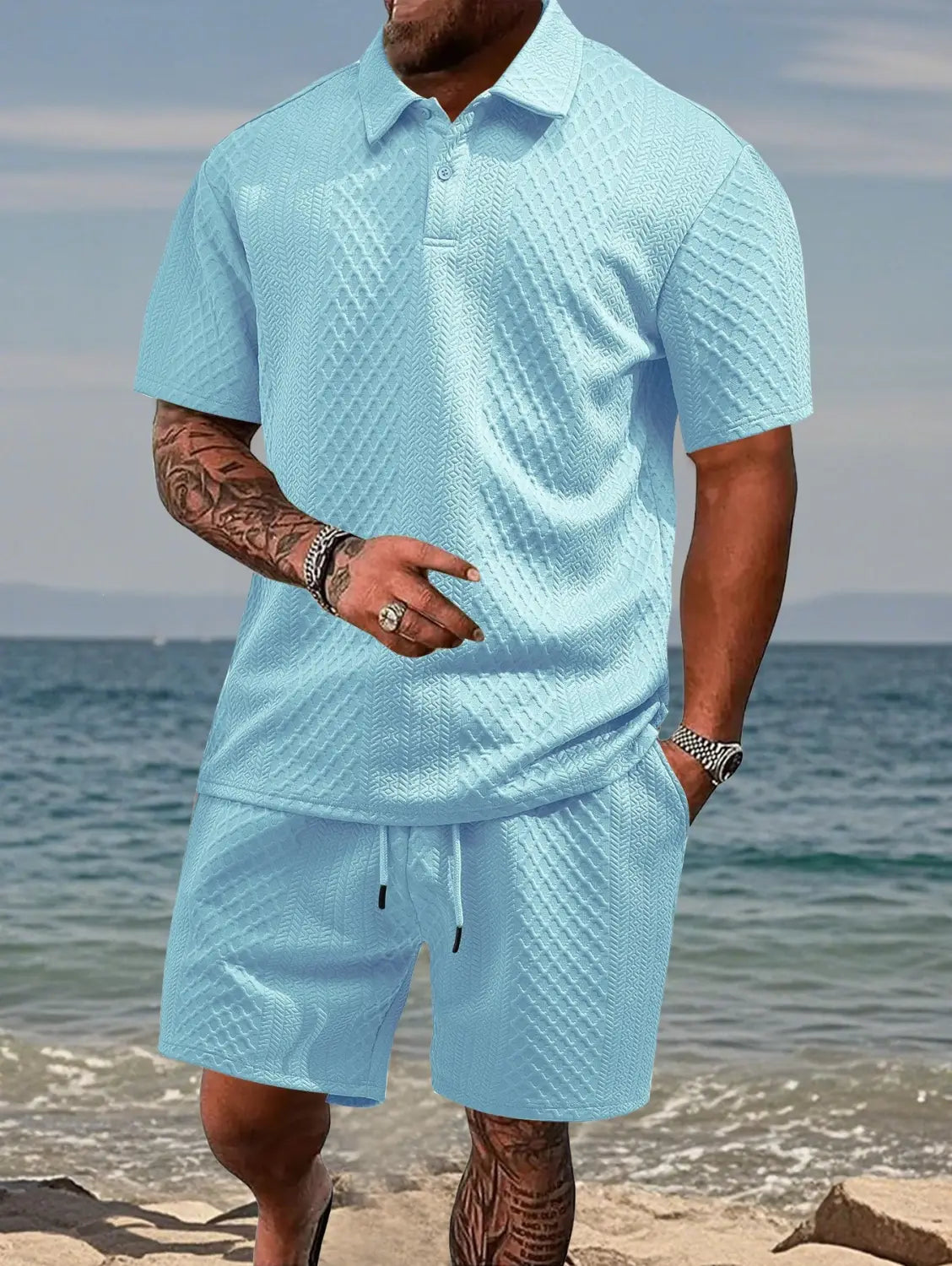 Light blue textured short sleeve polo shirt and matching shorts set made from breathable fabric for men.